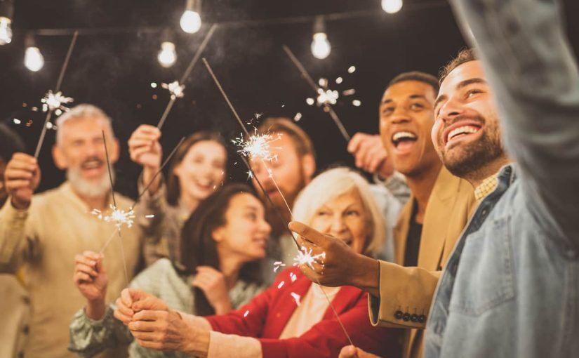 Group of people at party with sparklers