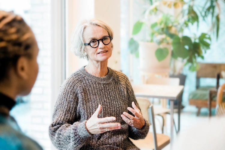 woman talking during group therapy