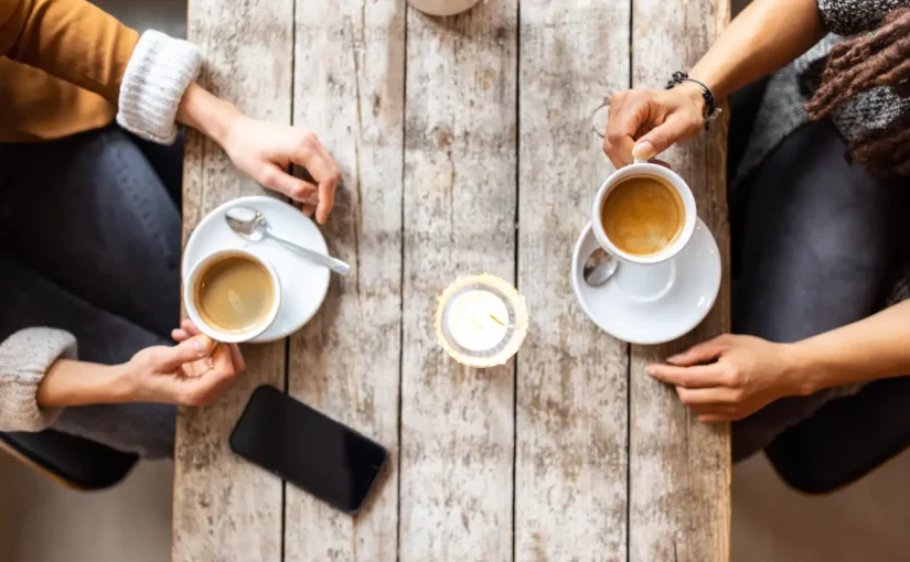 Two people in addiction recovery drinking coffee