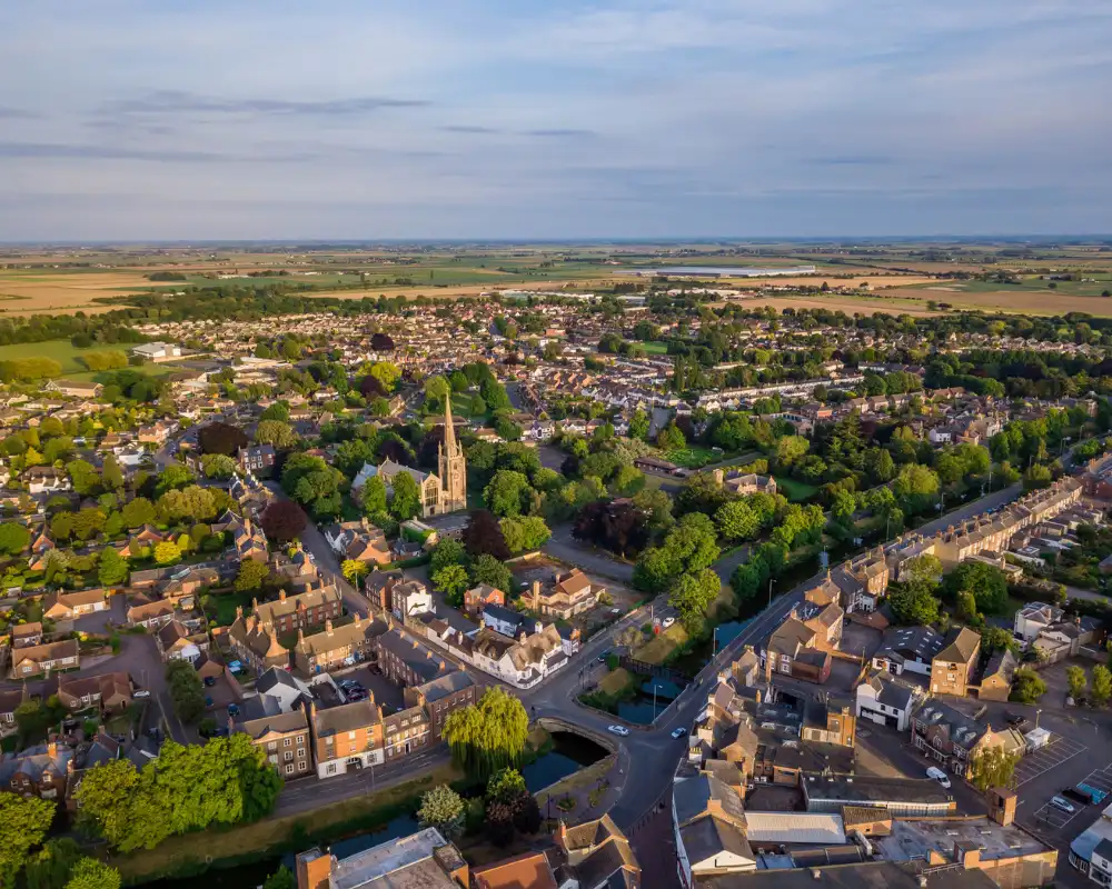 alcohol rehab Spalding. Aerial view of Spalding Town Centre south of the river including South Holland Centre, Church of St Mary and St Nicholas & River Welland