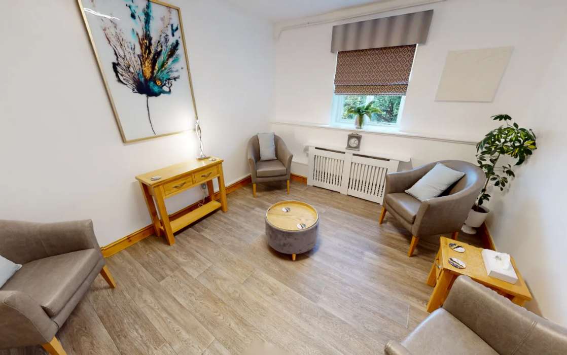 drug and alcohol rehab consultation room with chairs and table