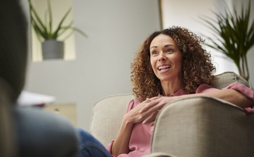 An image of a woman talking in an active therapy session.