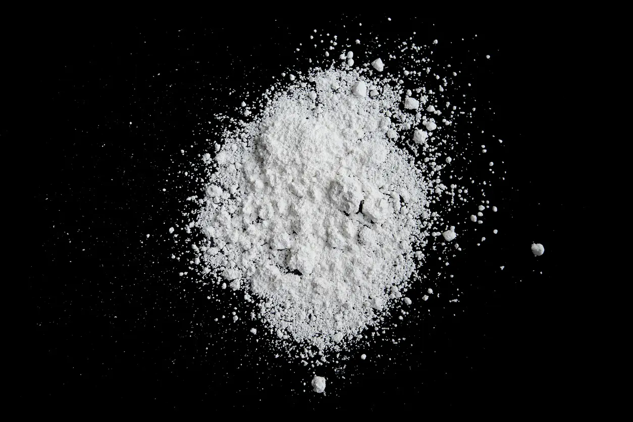 Monkey Dust Drug. An image of a white powder on a black background.